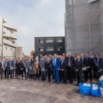 Delegation group photo at Seiwa Apartment job site